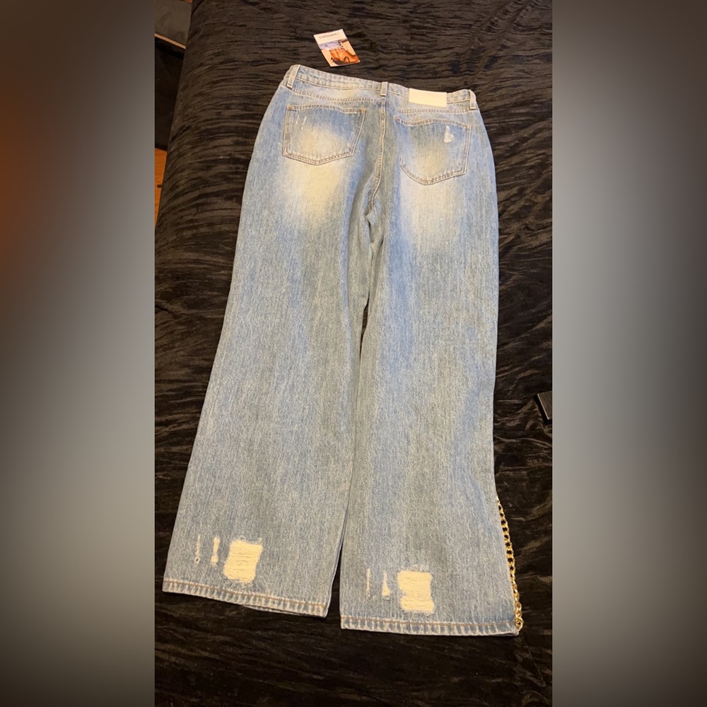 Gold chain down the seam. Straight legged baggy fit